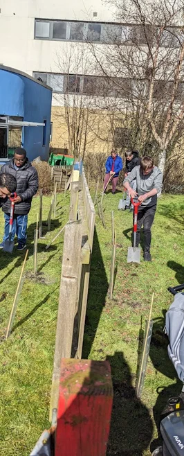 People trying out food at our food stall People trying out food at our food stall